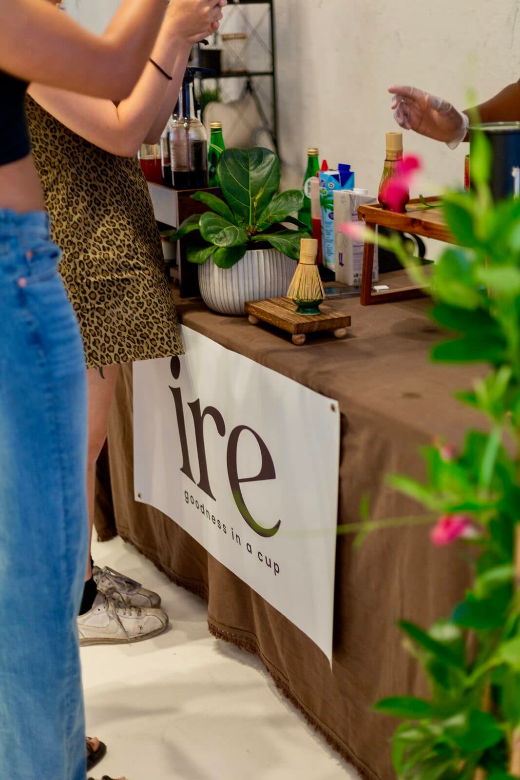 A matcha being poured over ice at the ire bar